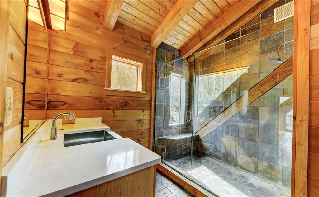 245 Silver Rock Road Adrian, PA 16210 - Photo 30 of 50 a bathroom with a sink and mirror