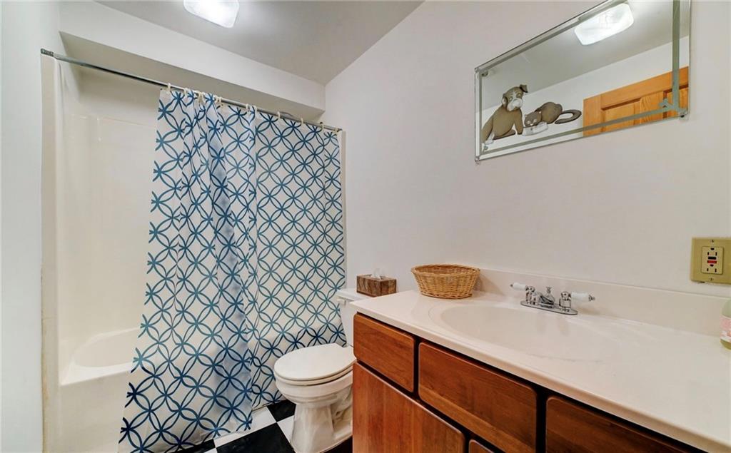 245 Silver Rock Road Adrian, PA 16210 - Photo 33 of 50 a bathroom with a granite countertop sink and a toilet