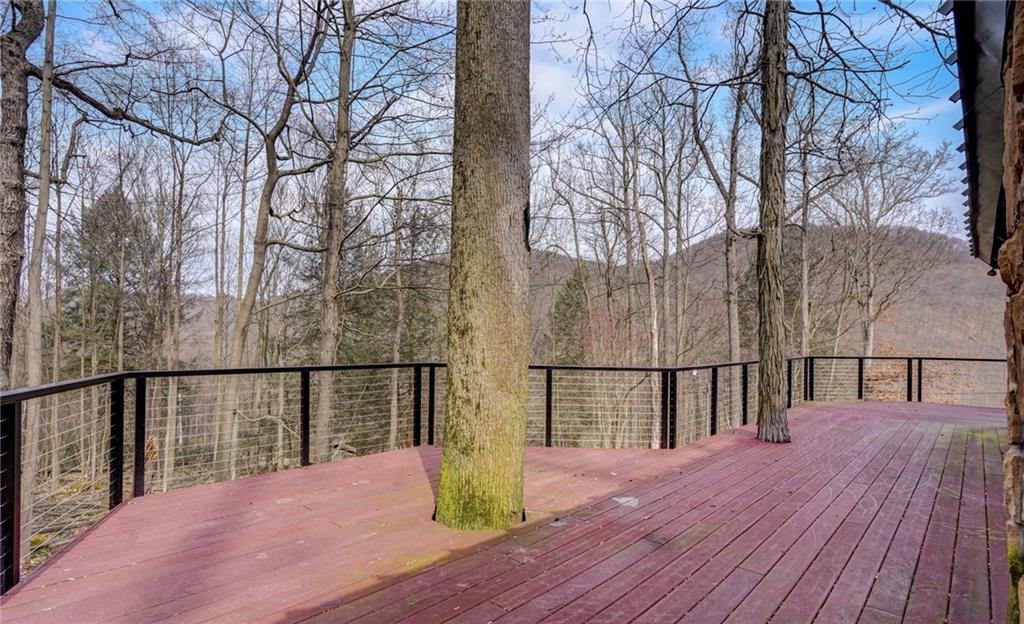 245 Silver Rock Road Adrian, PA 16210 - Photo 36 of 50 a balcony with wooden floor