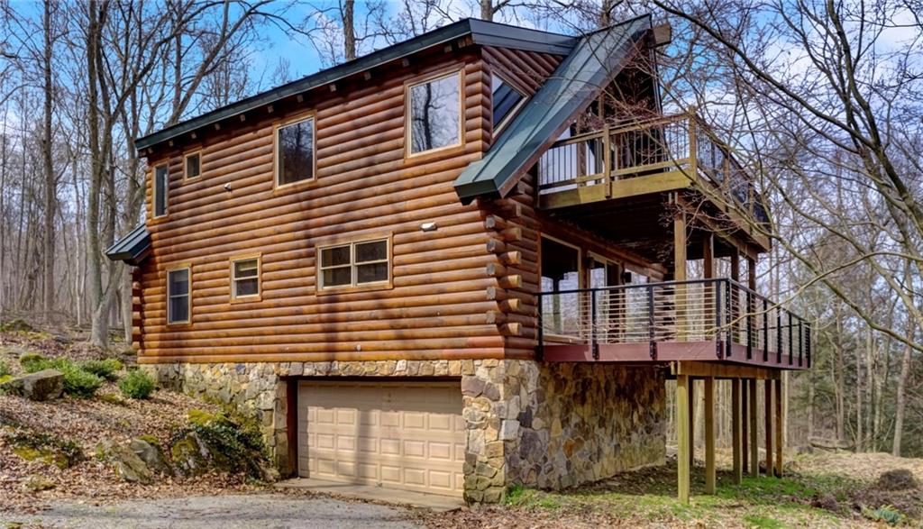 245 Silver Rock Road Adrian, PA 16210 - Photo 4 of 50 a front view of a house with a yard