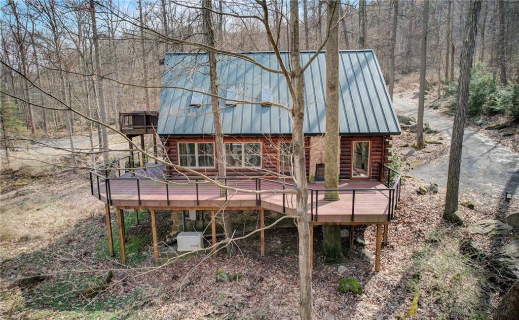 245 Silver Rock Road Adrian, PA 16210 - Photo 42 of 50 a view of a chairs and table in the backyard