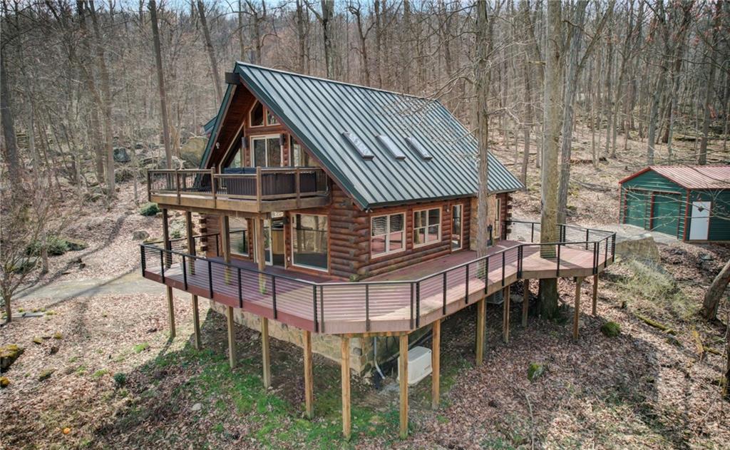 245 Silver Rock Road Adrian, PA 16210 - Photo 45 of 50 a view of a house with backyard and porch