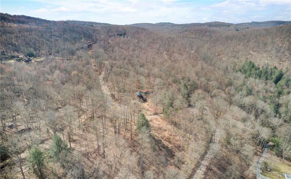 245 Silver Rock Road Adrian, PA 16210 - Photo 47 of 50 a view of a dry field with mountains in the background