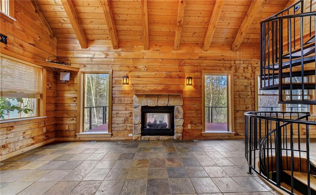245 Silver Rock Road Adrian, PA 16210 - Photo 7 of 50 a living room with a fireplace