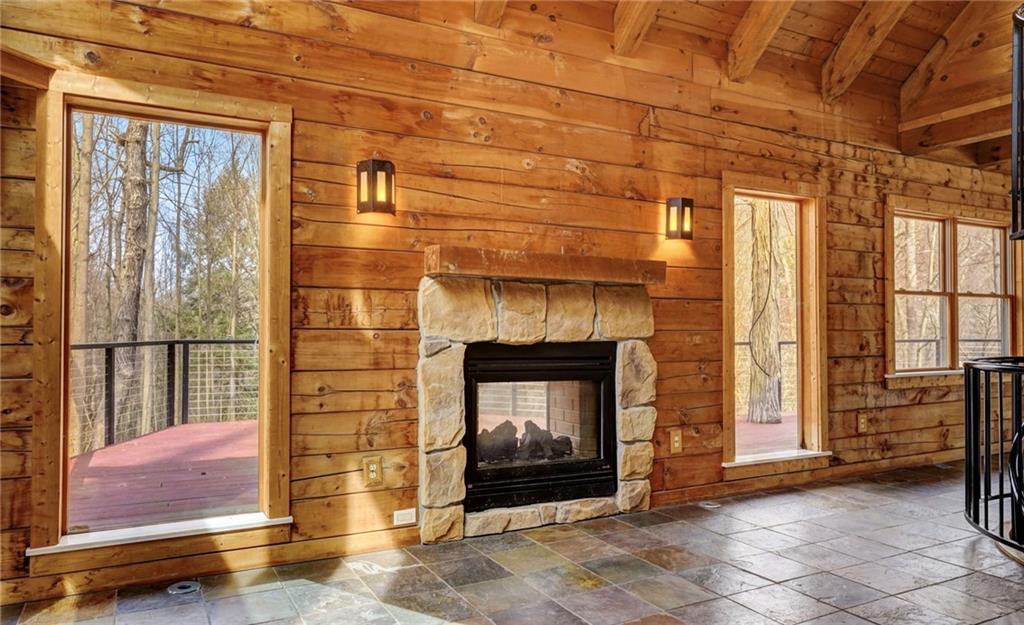245 Silver Rock Road Adrian, PA 16210 - Photo 9 of 50 a living room with a fireplace