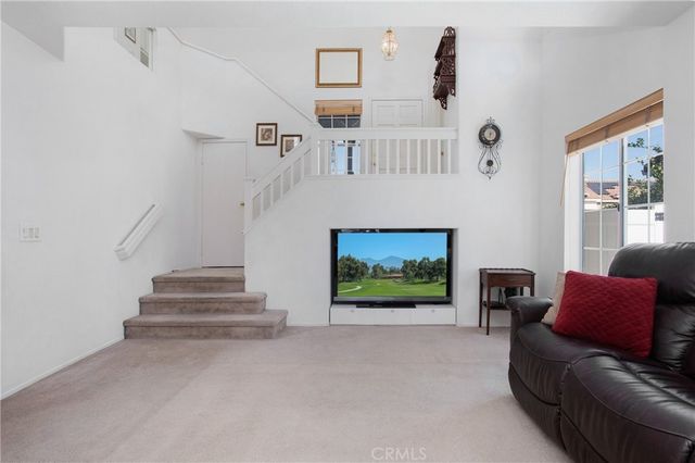 a kitchen with a sink and stainless steel appliances