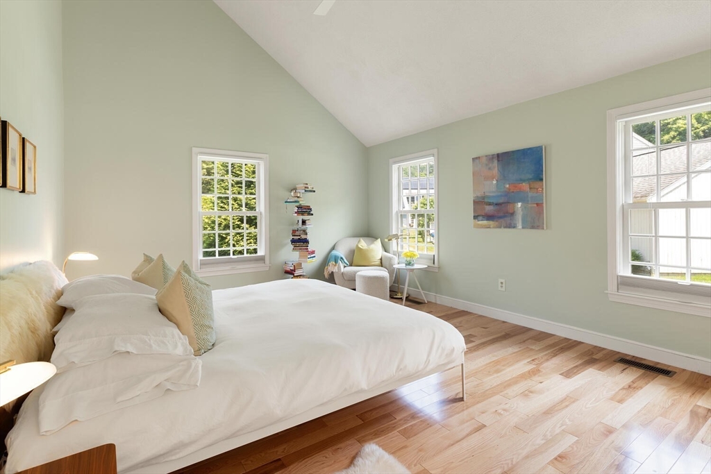 19 Edmonds Road Concord, MA 01742 - Photo 11 of 24 a bedroom with a bed and wooden floor