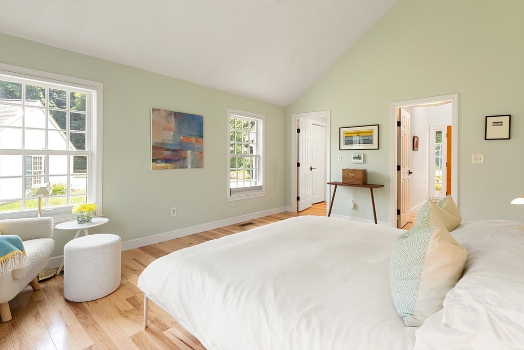 19 Edmonds Road Concord, MA 01742 - Photo 12 of 24 a bedroom with a bed and wooden floor