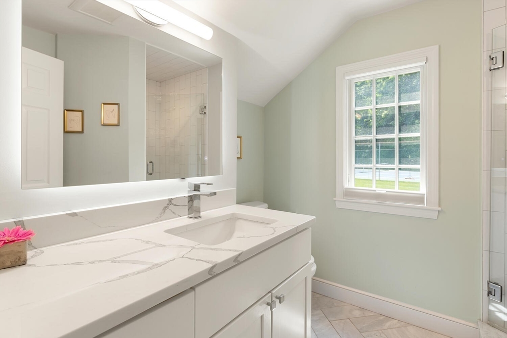 19 Edmonds Road Concord, MA 01742 - Photo 13 of 24 a bathroom with a sink and a mirror