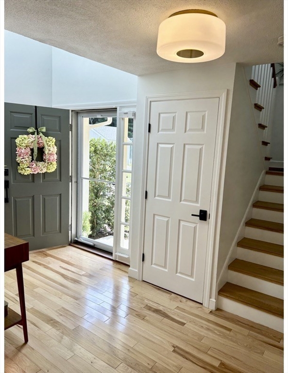 19 Edmonds Road Concord, MA 01742 - Photo 2 of 24 wooden floor in an empty room with a window