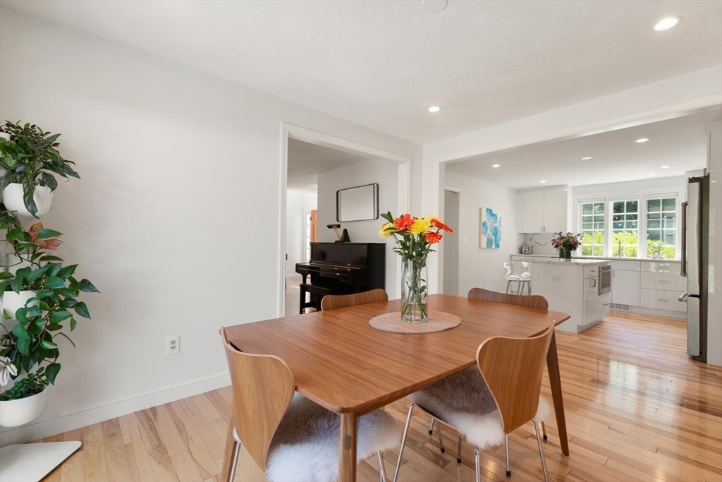 19 Edmonds Road Concord, MA 01742 - Photo 6 of 24 a view of a dining room with furniture and wooden floor