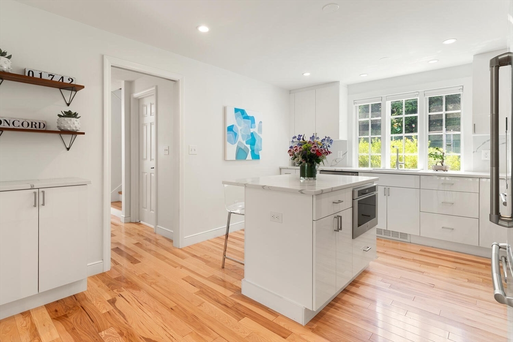 19 Edmonds Road Concord, MA 01742 - Photo 8 of 24 a kitchen with a sink cabinets appliances and a window