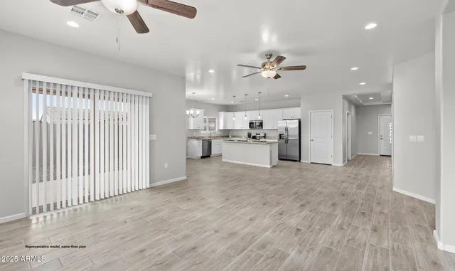a view of a kitchen with a sink and a stove top oven