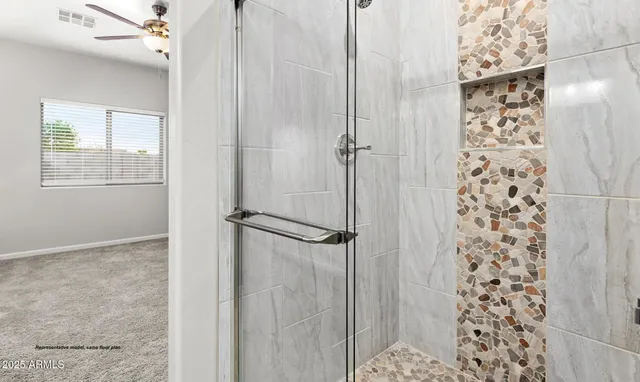 a bathroom with a shower and a sink