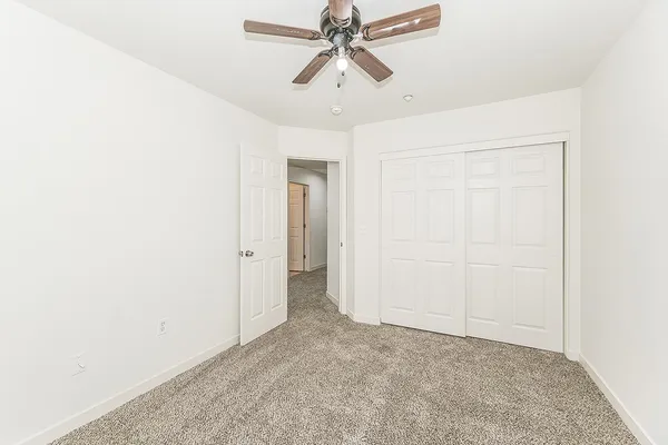 a view of a chandelier fan in a room