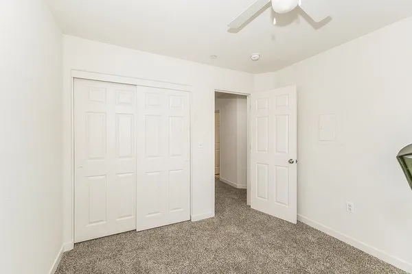 an empty room with fan