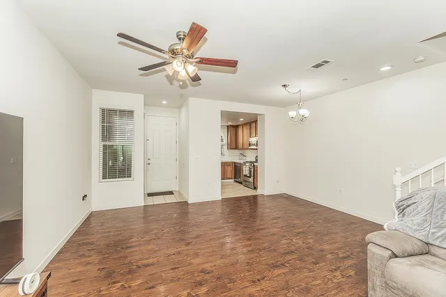 a view of livingroom with hardwood floor and ceiling fan