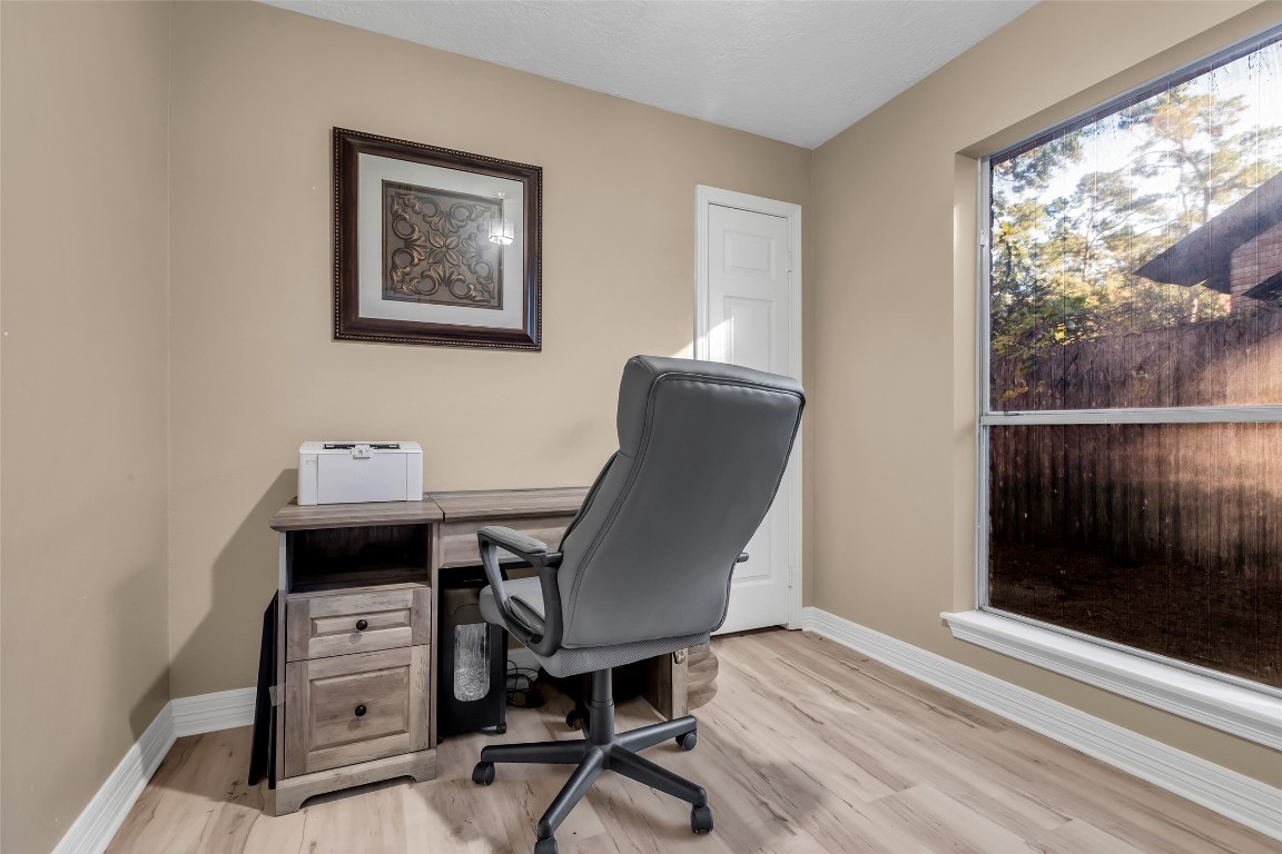 24102 Northcrest Drive Spring, TX 77389 - Photo 11 of 30 a view of a workspace with furniture and a window