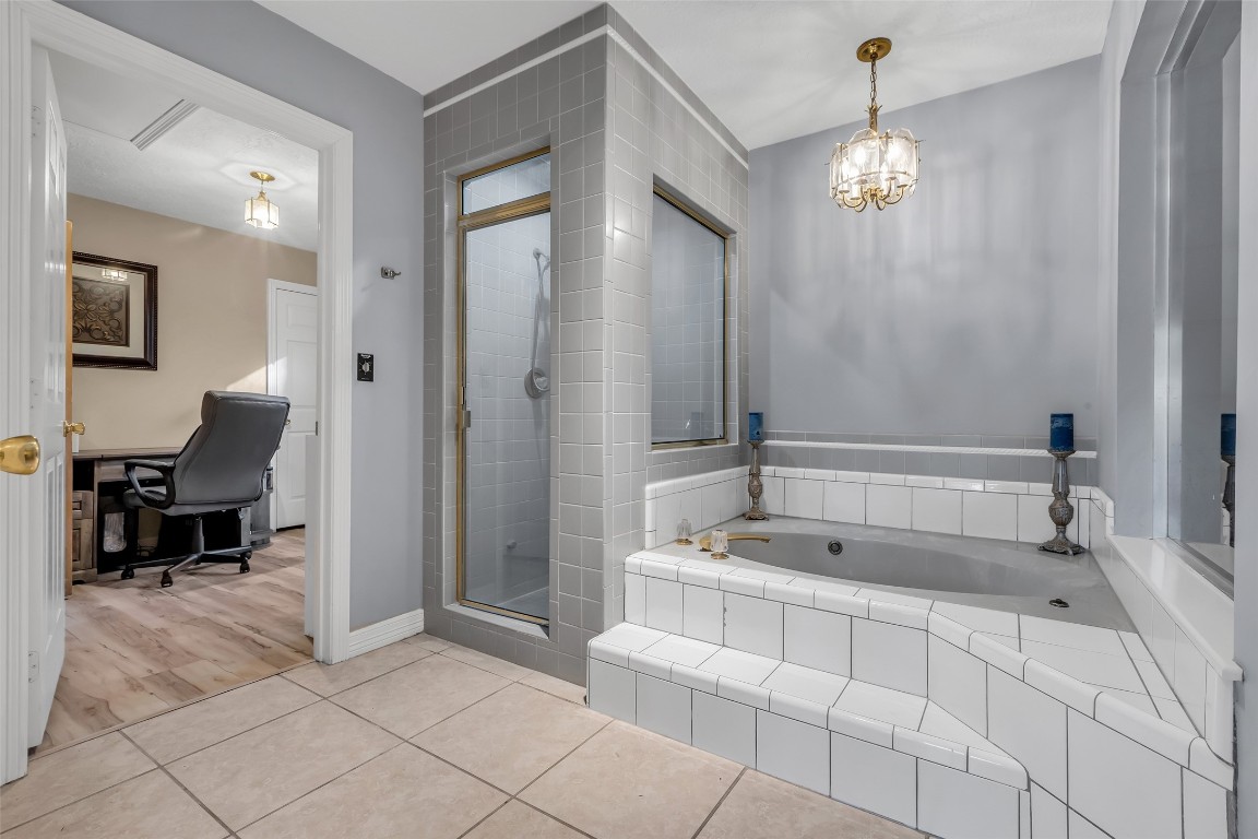 24102 Northcrest Drive Spring, TX 77389 - Photo 12 of 30 a spacious bathroom with a tub sink and mirror