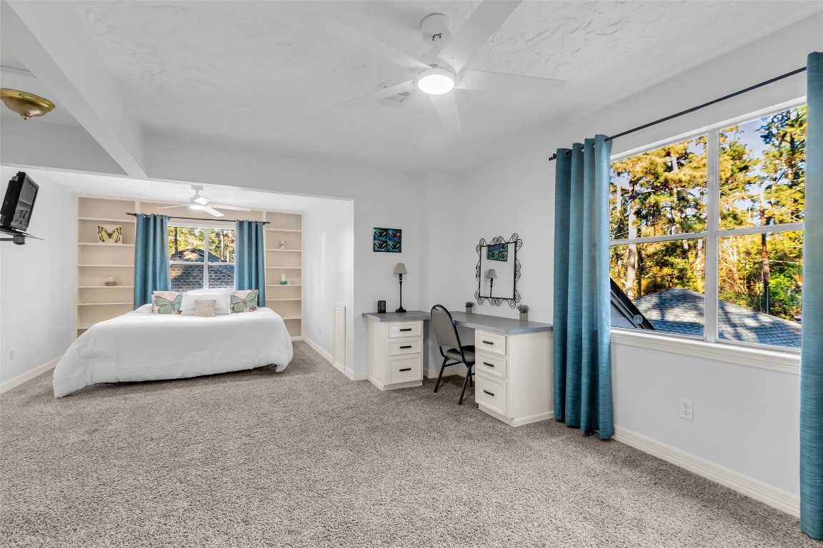 24102 Northcrest Drive Spring, TX 77389 - Photo 15 of 30 a spacious bedroom with a large bed and a window