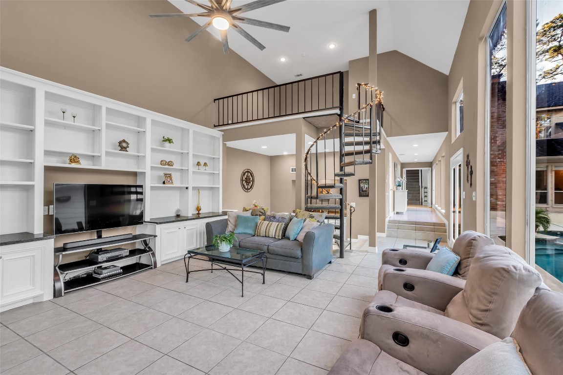 24102 Northcrest Drive Spring, TX 77389 - Photo 21 of 30 a living room with furniture and a flat screen tv