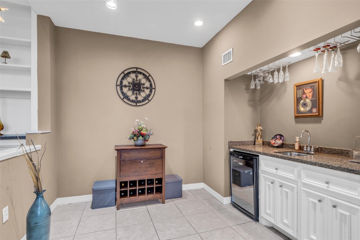 24102 Northcrest Drive Spring, TX 77389 - Photo 22 of 30 a living room with a sink and a table with wooden floor