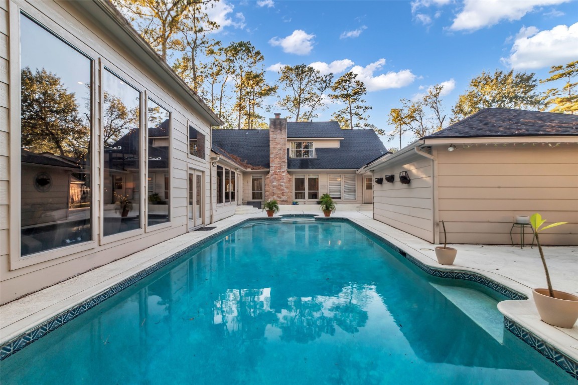 24102 Northcrest Drive Spring, TX 77389 - Photo 24 of 30 a view of a house with a swimming pool