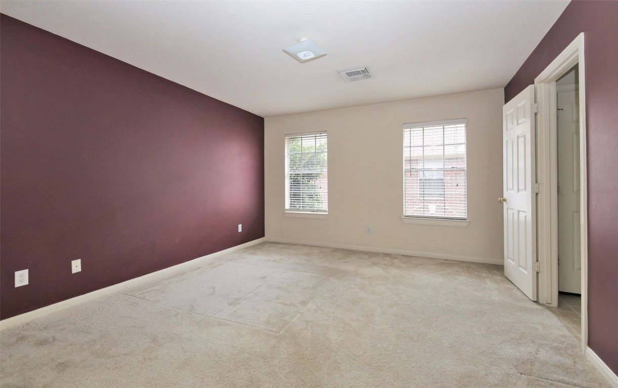 11735 Alief Clodine Road, Unit 22 Houston, TX 77072 - Photo 12 of 23 an empty room with windows