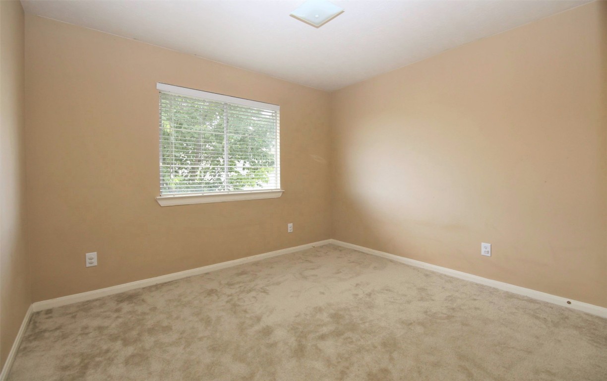 11735 Alief Clodine Road, Unit 22 Houston, TX 77072 - Photo 17 of 23 an empty room with a window