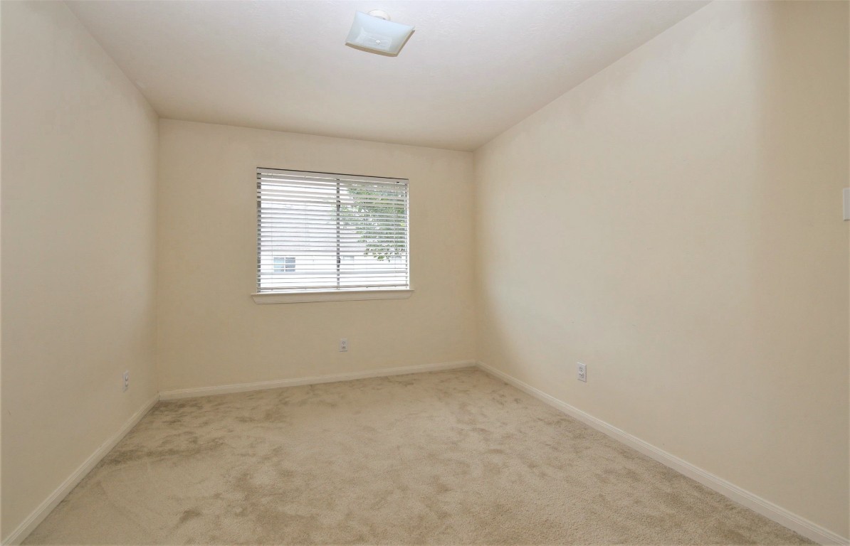 11735 Alief Clodine Road, Unit 22 Houston, TX 77072 - Photo 20 of 23 an empty room with a window
