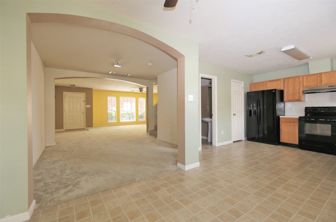11735 Alief Clodine Road, Unit 22 Houston, TX 77072 - Photo 6 of 23 a view of a kitchen with refrigerator and kitchen