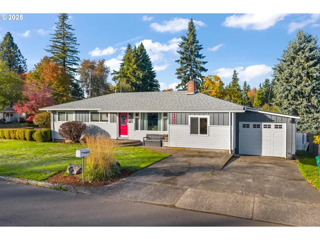 a view of a house with wooden fence