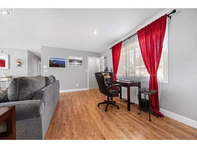 a living room with furniture and a window