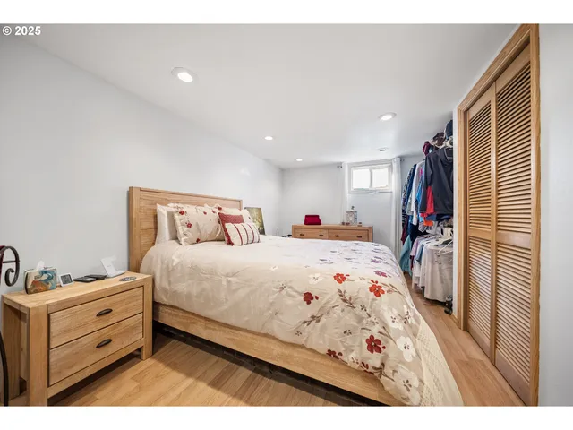 a bedroom with a bed and a closet