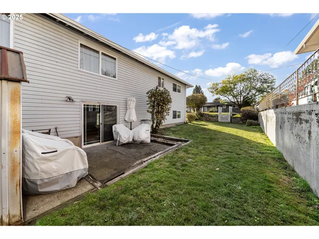 a view of a backyard with a patio