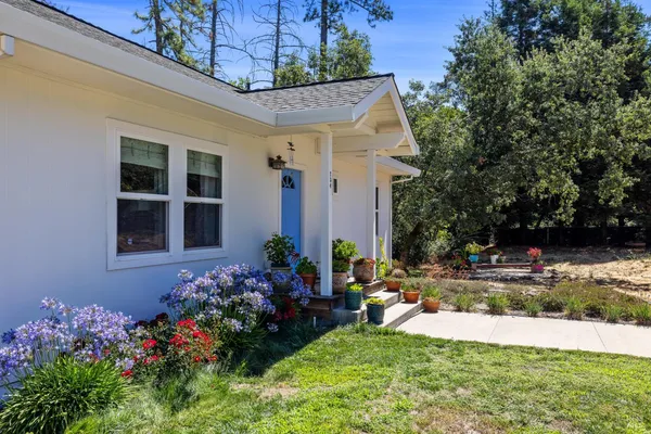 a front view of a house with a yard