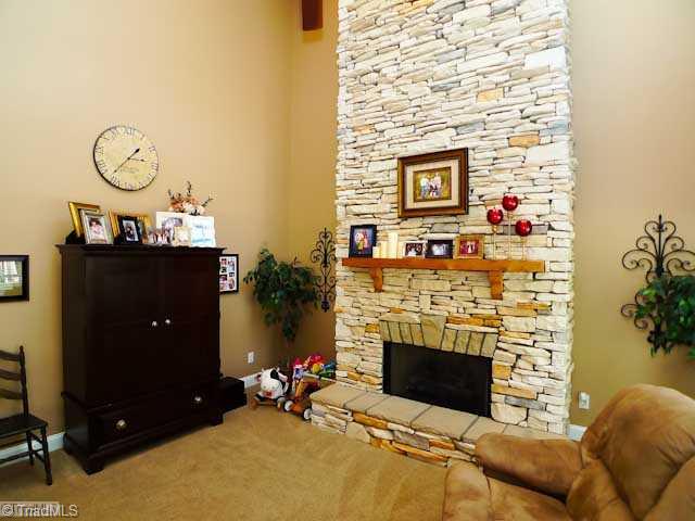 9123 County Line Road Kernersville, NC 27284 - Photo 5 of 16 Living Room. Two story stone fireplace