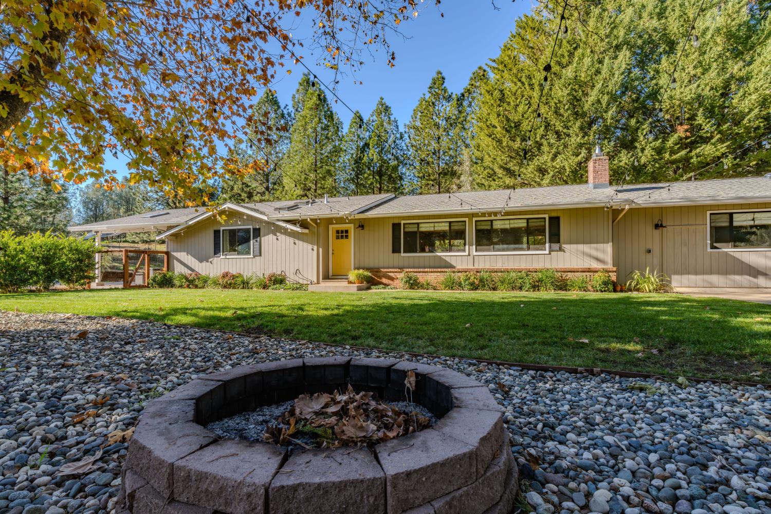 10376 Tabeaud Road Pine Grove, CA 95665 - Photo 2 of 70 a front view of a house with garden