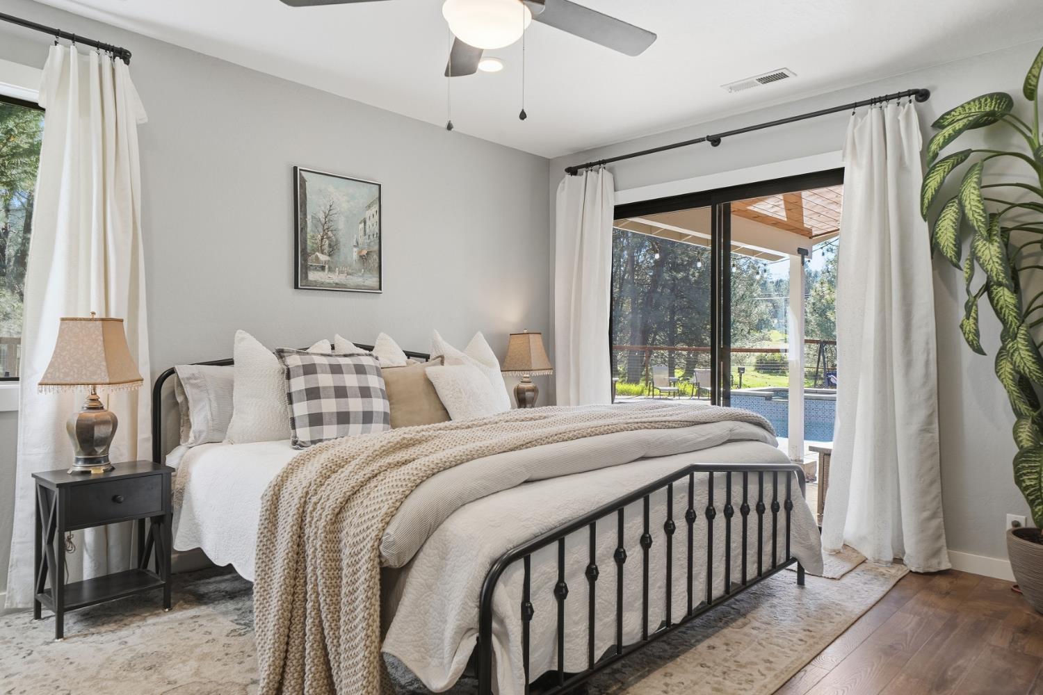 10376 Tabeaud Road Pine Grove, CA 95665 - Photo 46 of 70 a bedroom with a bed and a large window