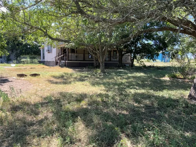 a view of gallery with wooden floor