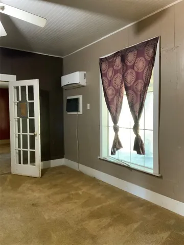 a view of empty room with windows