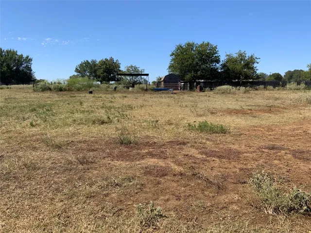 a view of a lake in middle of forest