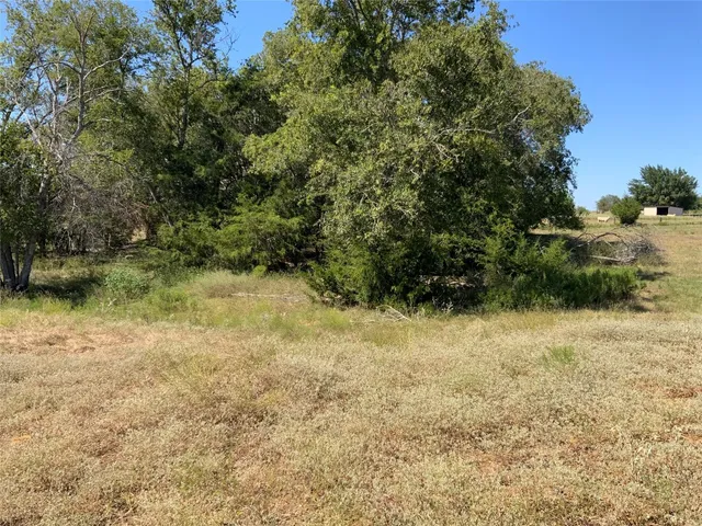 a view of swimming pool with wooden fence