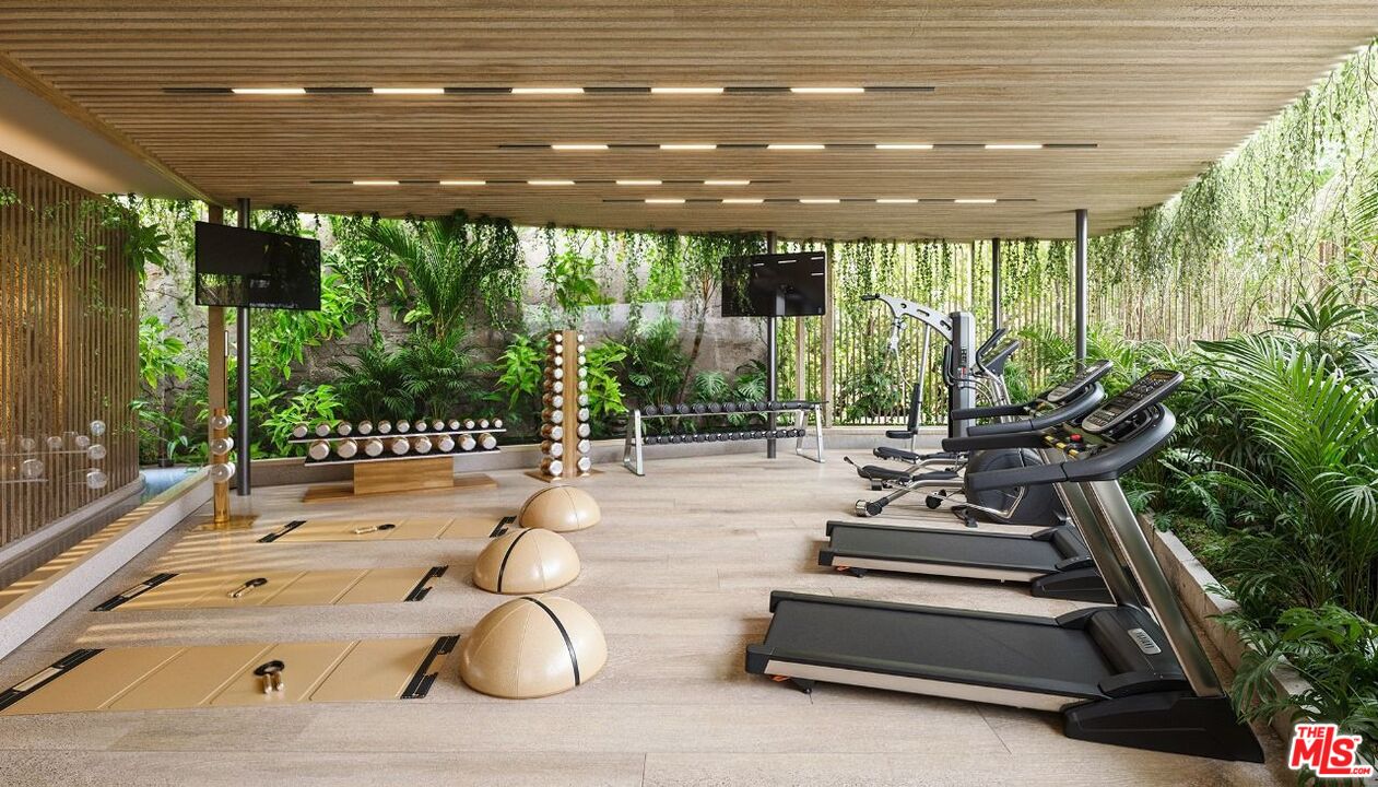 703 Ocean Studio Costa Rica Other, XX 0 - Photo 9 of 11 a view of a patio with table and chairs potted plants with floor to ceiling window