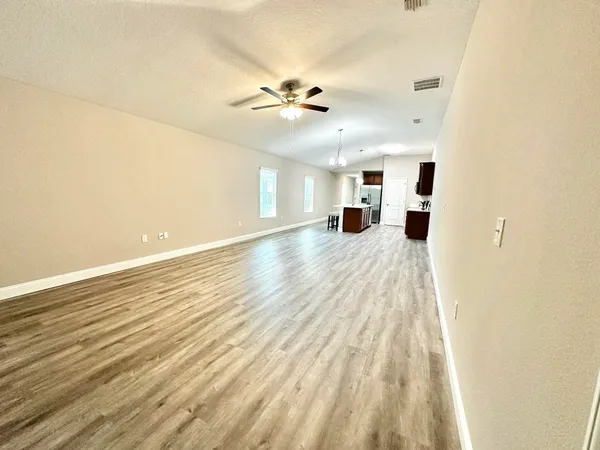 a view of an empty room with a window