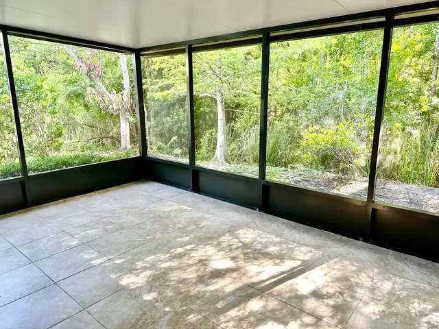 a view of an empty room with a large window