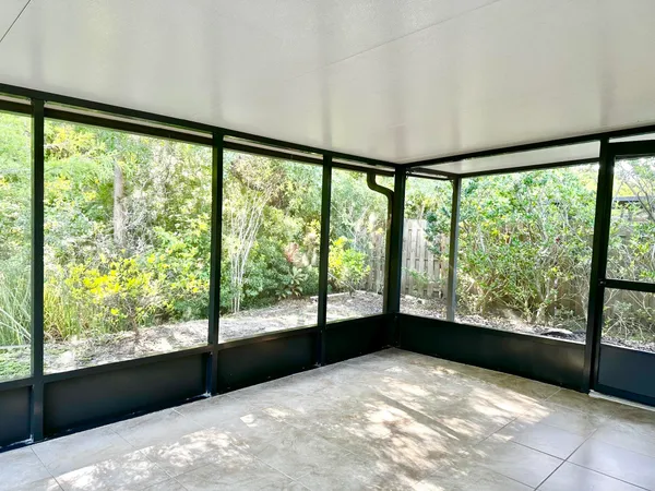 a view of an empty room with a large window