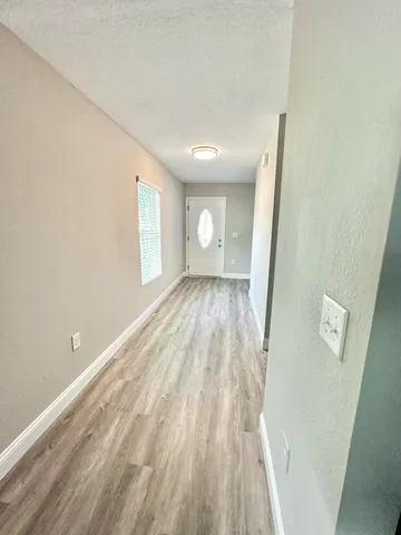 a view of an empty room and window