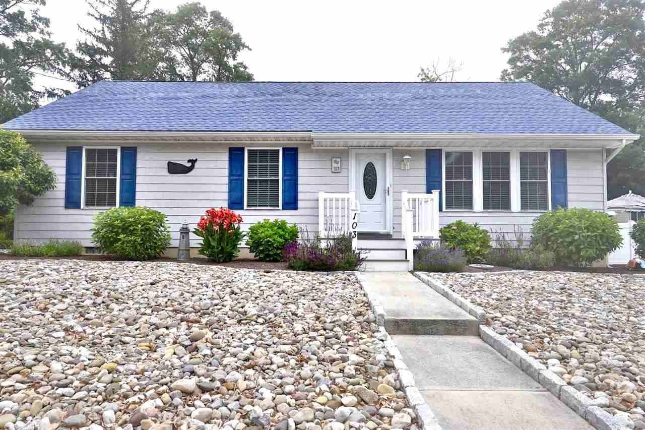 103 Avalon Road Cape May, NJ 08204 - Photo 1 of 33 a front view of a house with garden