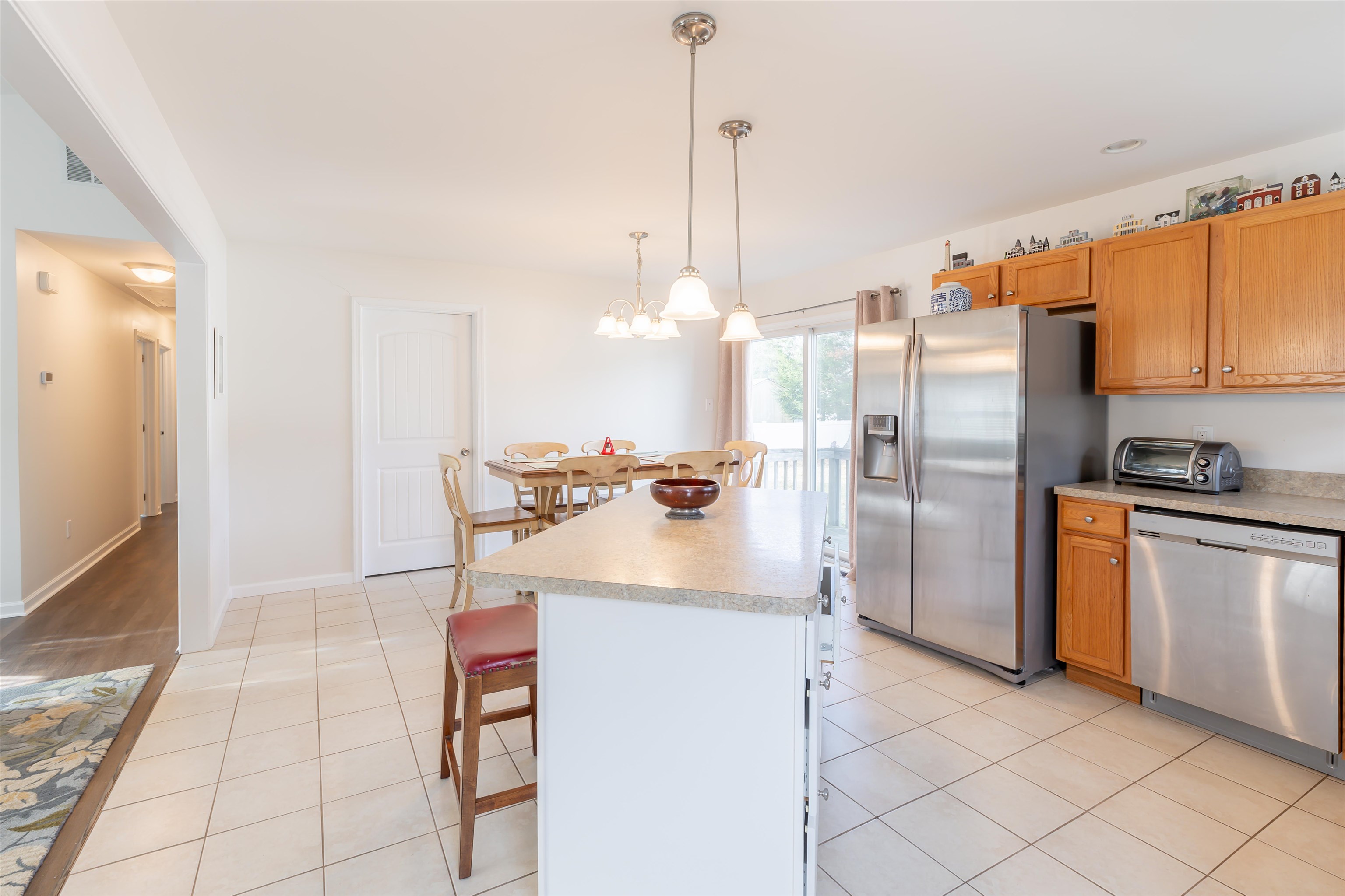 103 Avalon Road Cape May, NJ 08204 - Photo 11 of 33 a kitchen with stainless steel appliances a refrigerator sink and cabinets